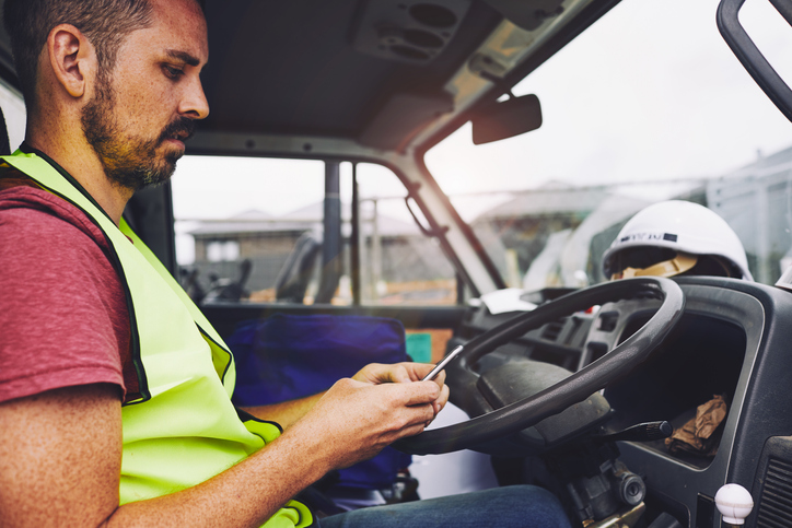 Tradie using his phone 1054724792 v2